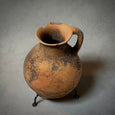 A VINTAGE TERRA-COTTA VESSEL