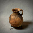 A VINTAGE TERRA-COTTA VESSEL