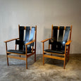 Pair of Leather Strapped Arm Chairs