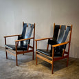 Pair of Leather Strapped Arm Chairs