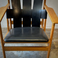 Pair of Leather Strapped Arm Chairs